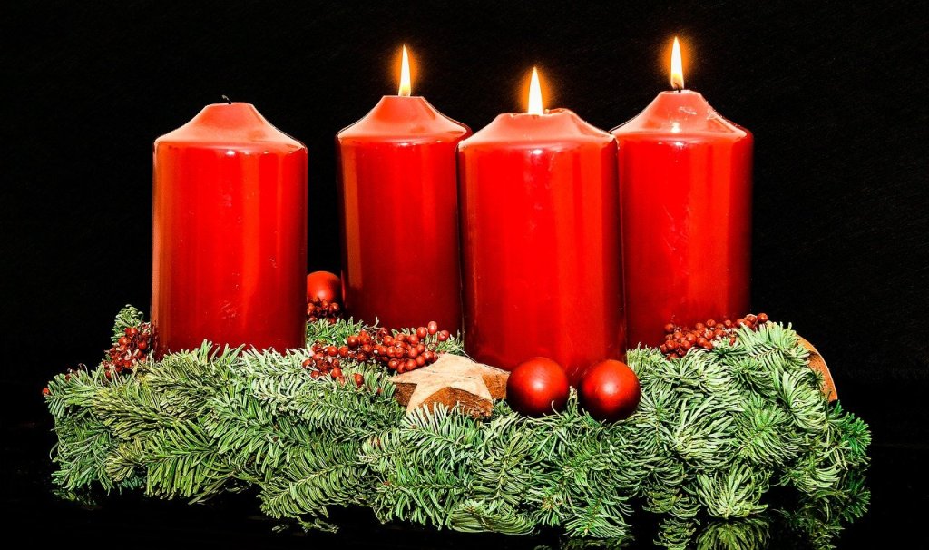 Advent wreath with three burning candles. 